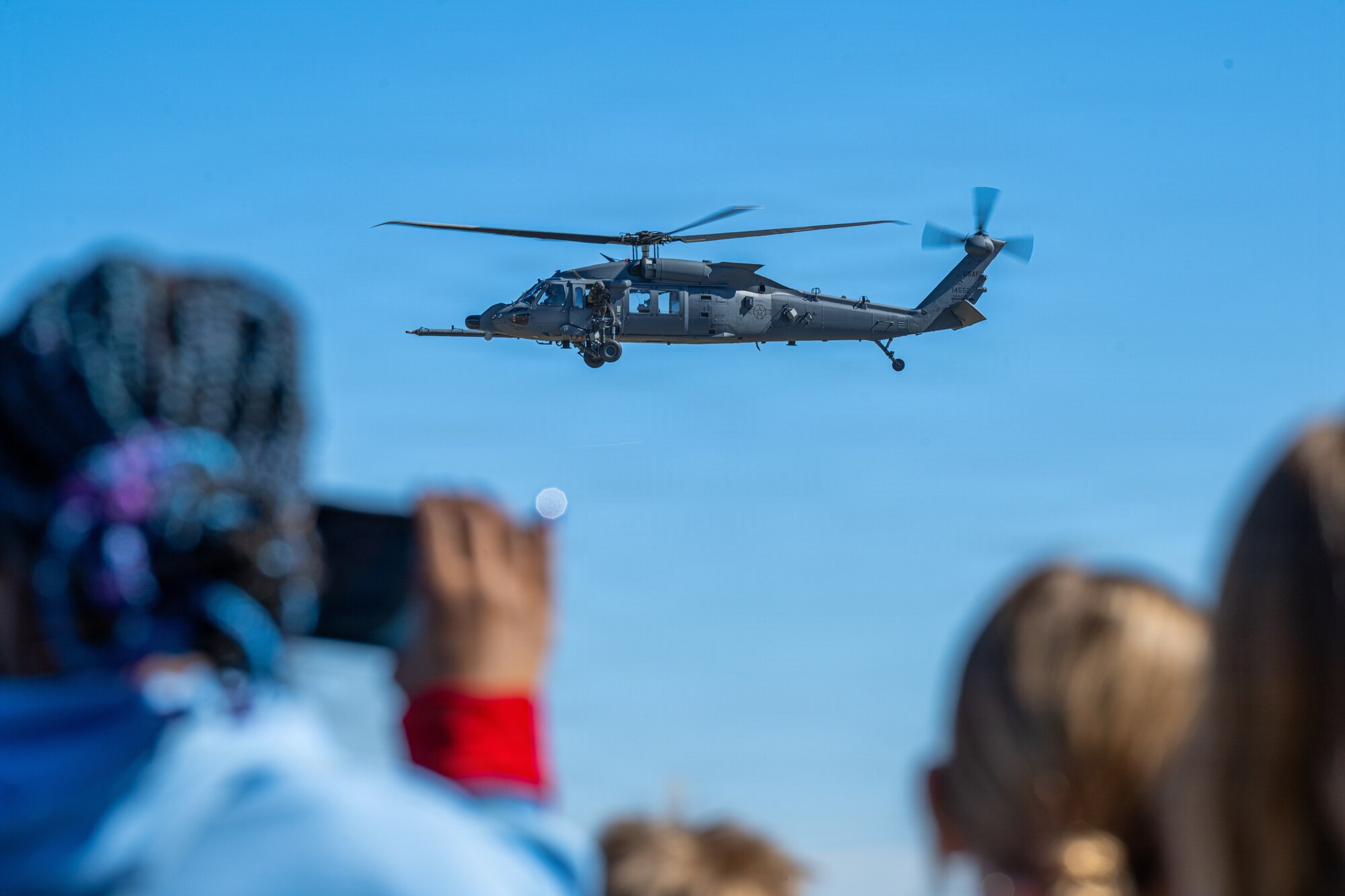 An HH-60W Jolly Green II helicopter assigned to the 41st Rescue Squadron performs rescue maneuvers during an aerial demonstration at Saluting Our Aviation Roots (SOAR) at Moody Air Force Base, Georgia, Feb. 24, 2025. The aircraft’s demonstration showed off its rescue capabilities and the squadrons’ commitment to maintaining operational readiness. (U.S. Air Force photo by Airman 1st Class Noah Noonan)