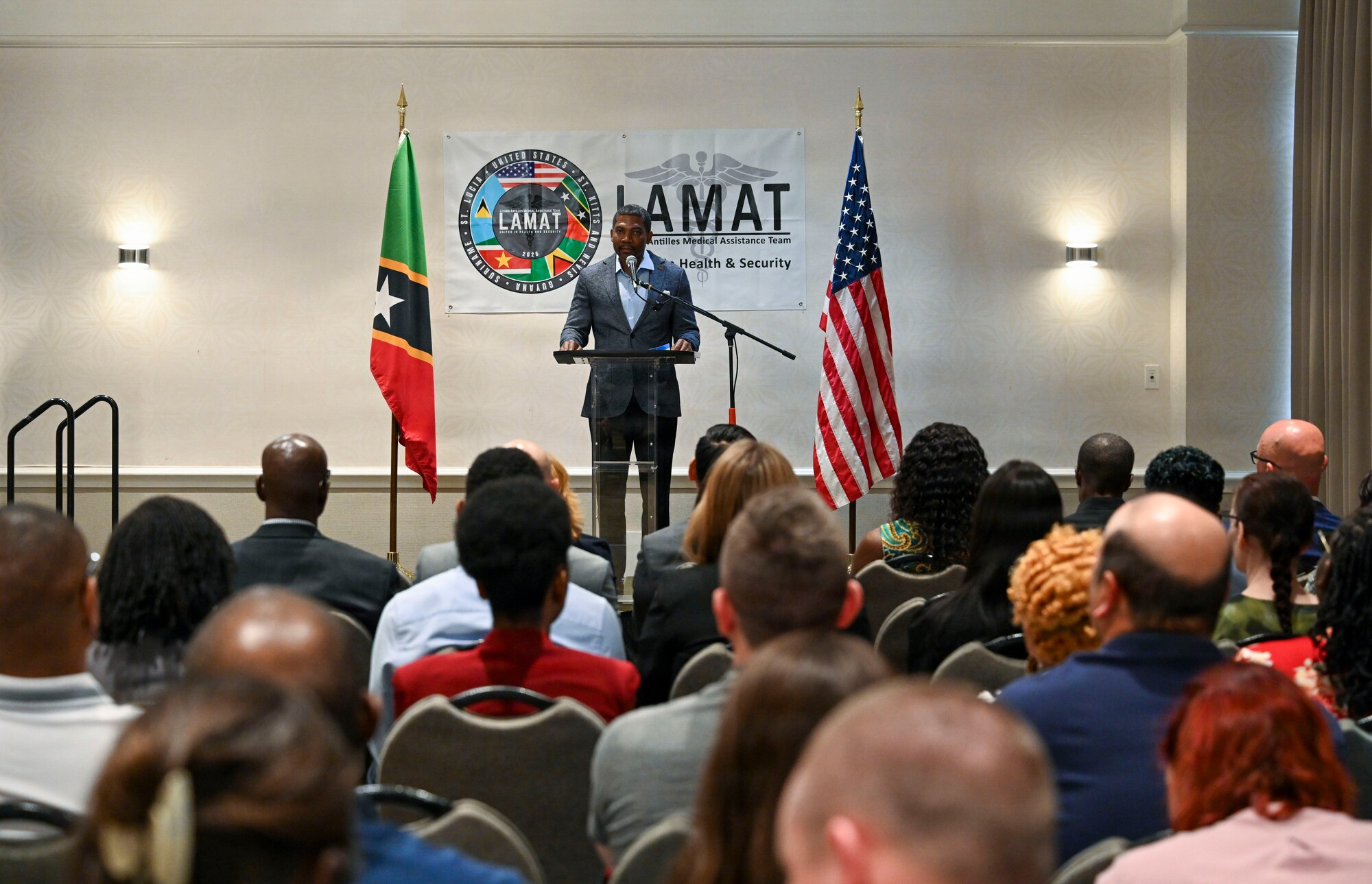 Saint Kitts and Nevis Prime Minister Dr. Terrance Drew provides remarks during the Lesser Antilles Medical Assistance Team (LAMAT) 2026 opening ceremony, in Basseterre, Saint Kitts on Feb. 22, 2026. Drew underscored the impact of continued partnership on healthcare resilience across the Federation. (U.S. Air Force Photo by Staff Sgt. Dakota Carter)