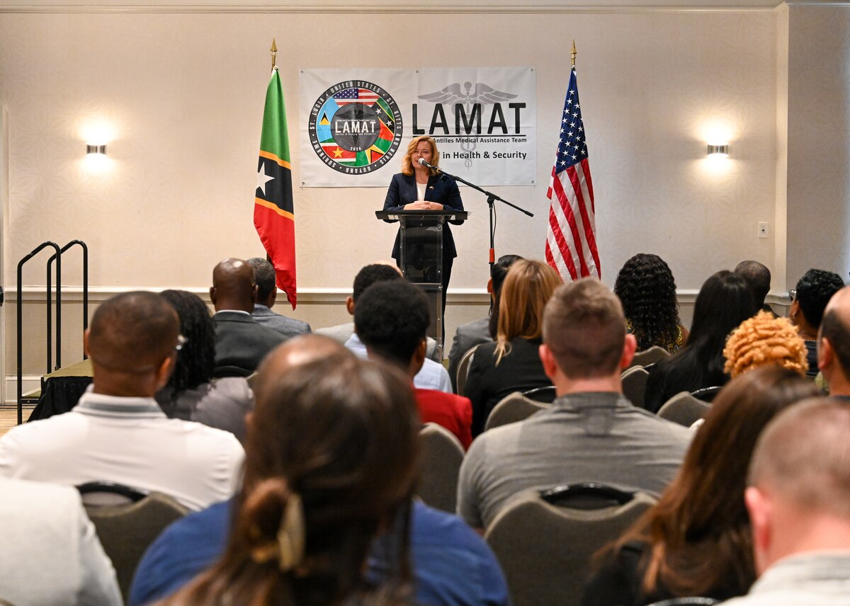 Karin Sullivan, U.S. Chargé d’Affaires, U.S. Embassy, Bridgetown, Barbados provides remarks during the Lesser Antilles Medical Assistance Team (LAMAT) 2026 opening ceremony, in Basseterre, Saint Kitts on Feb. 22, 2026. The ceremony marked the beginning of the third LAMAT engagement between the United States and Saint Kitts and Nevis. (U.S. Air Force Photo by Staff Sgt. Dakota Carter)