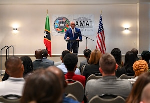 U.S. Air Force Lt. Col. Barry Davis, general surgeon and LAMAT 2026 mission commander, speaks during the Lesser Antilles Medical Assistance Team (LAMAT) 2026 opening ceremony, in Basseterre, Saint Kitts on Feb. 22, 2026. Davis previously participated in the Federation’s first LAMAT engagement in 2024 and now returns as the mission commander. (U.S. Air Force Photo by Staff Sgt. Dakota Carter)