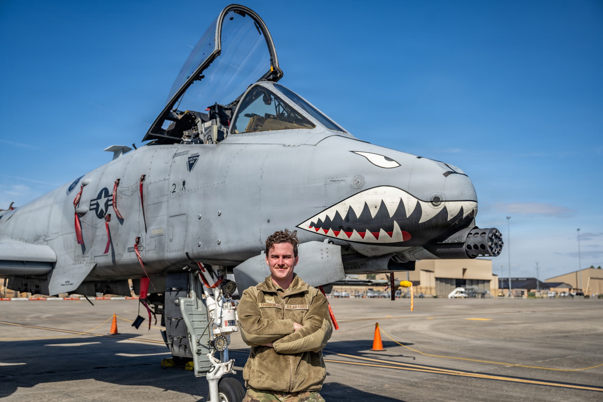 A U.S. Air Force Airman assigned to the 23d Wing poses for a photo during Saluting Our Aviation Roots (SOAR) at Moody Air Force Base, Georgia, Feb. 25, 2026. The Airman explained his role to local students as a maintainer on the A-10C Thunderbolt II. (U.S. Air Force photo by Senior Airman Savannah Carpenter)