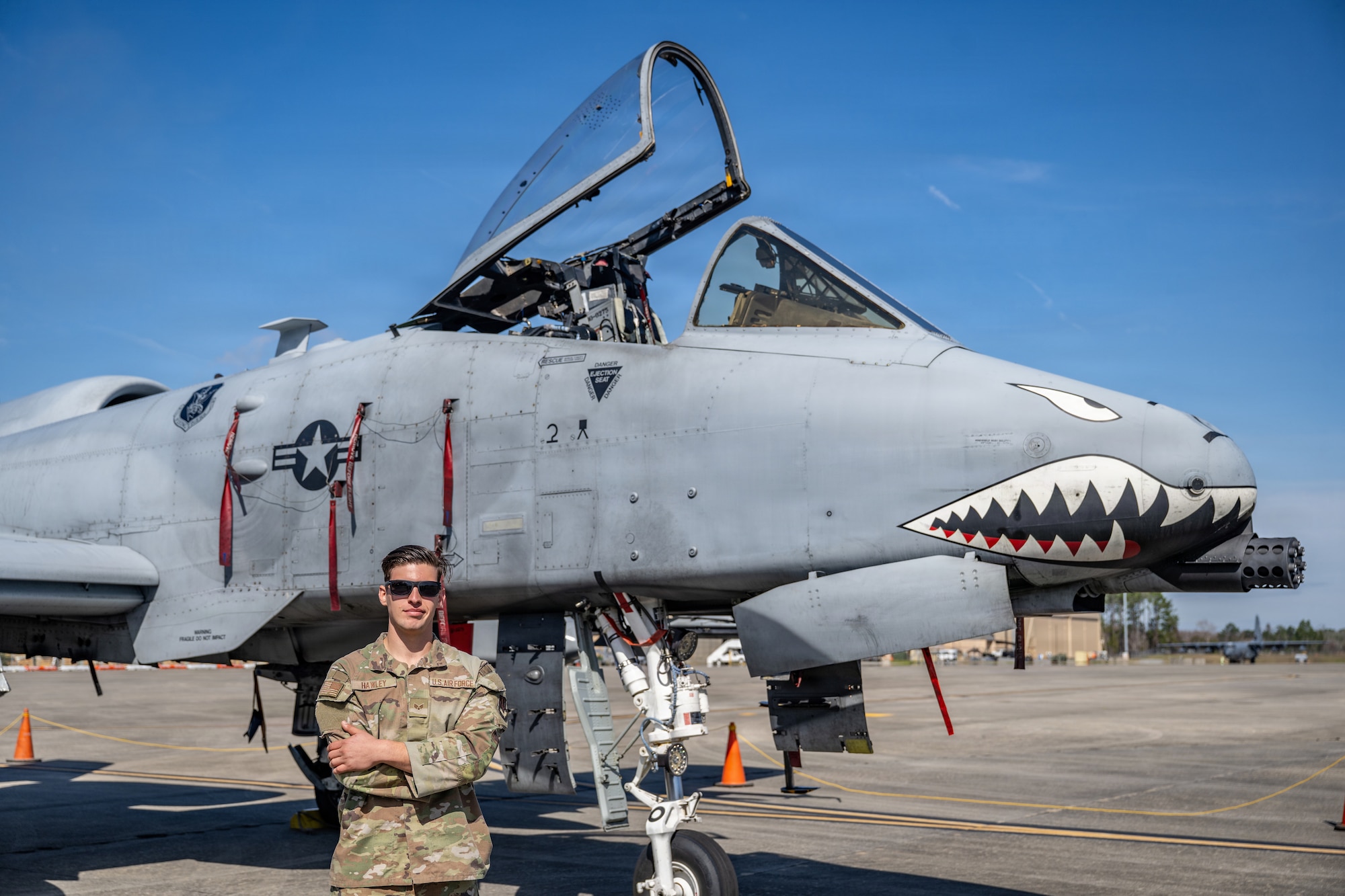 A U.S. Air Force Airman assigned to the 23d Wing poses for a photo during Saluting Our Aviation Roots (SOAR) at Moody Air Force Base, Georgia, Feb. 25, 2026.The Airman highlights the critical maintenance efforts to students that keep the A-10C Thunderbolt II combat-capable. (U.S. Air Force photo by Senior Airman Savannah Carpenter)