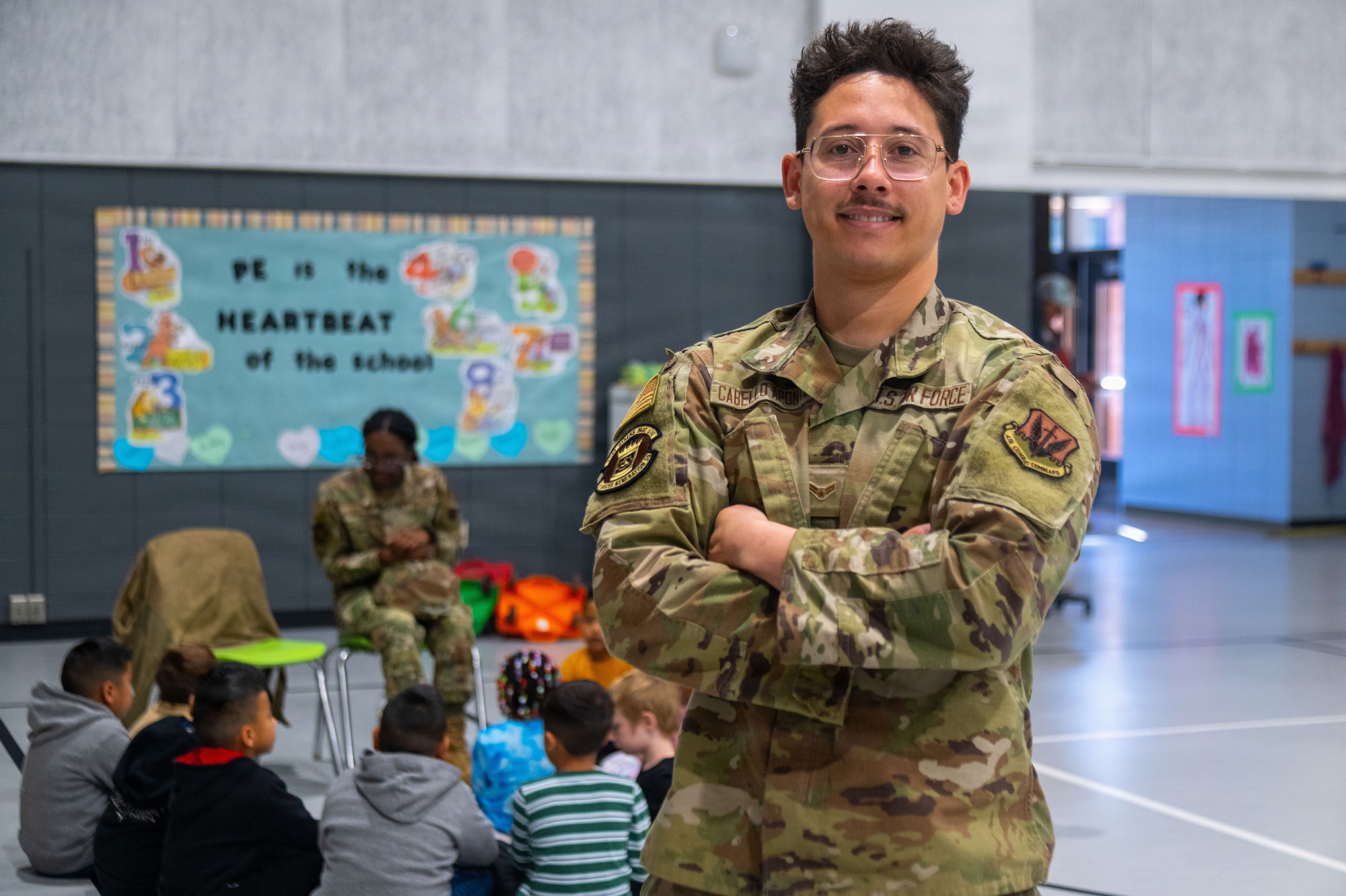 U.S. Air Force Airman 1st Class Jafet Cabello-Aponte, 71st Rescue Generation Squadron crew chief, poses for a portrait during a volunteer school visit at Cook Primary School, Adel, Georgia, Feb. 23, 2025. Members across Moody AFB spoke with students about their roles on across base learning about the Air Force and its mission. (U.S. Air Force photo by Airman 1st Class Noah Noonan)