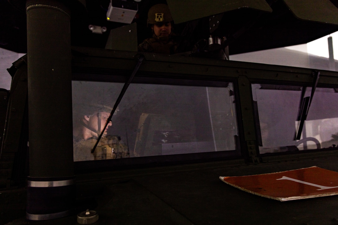 U.S. Marines with Marine Wing Support Squadron 371, Marine Air Control Group 38, 3rd Marine Aircraft Wing, participate in a tactical convoy simulator training during a company field exercise at Marine Corps Base Camp Pendleton, California, Feb. 24, 2026. The exercise demonstrated the unit’s ability to sustain ground transportation operations for 3rd MAW in support of the Marine Air Ground Task Force. (U.S. Marine Corps photo by Lance Cpl. Samantha Devine)