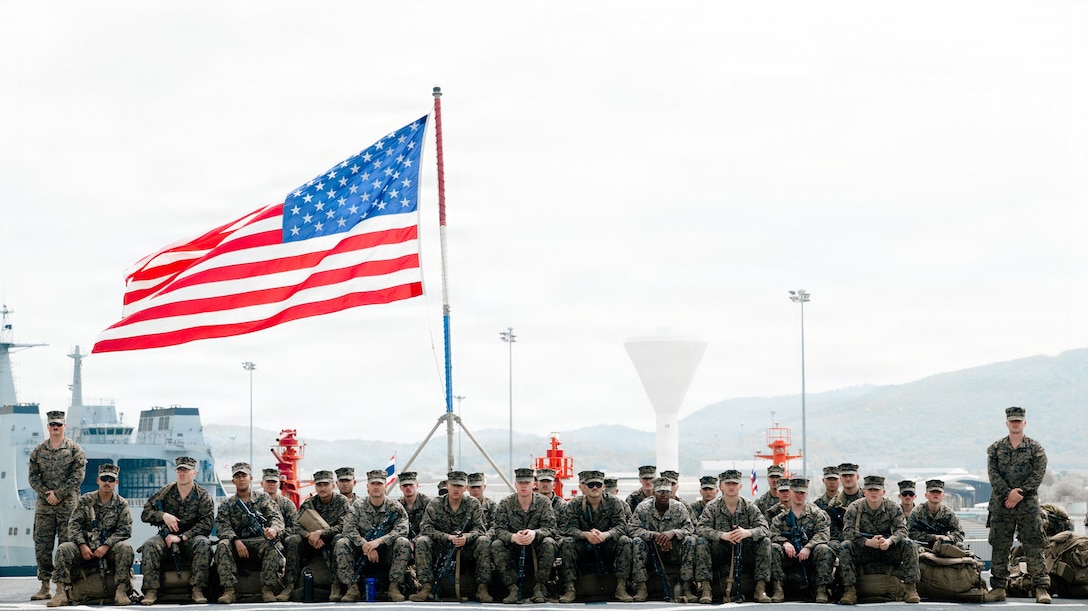 U.S. Marines and sailors assigned to Task Force Ashland, I Marine Expeditionary Force, pose for a photo as they prepare to debark amphibious dock landing ship USS Ashland (LSD 48) in support of Exercise Cobra Gold 2026 at Chuk Samet in the Gulf of Thailand, Feb. 22, 2026. Cobra Gold is the Indo-Pacific’s largest annual military exercise in mainland Asia, co-hosted by the U.S. and Thailand. The exercise brings together participants from multiple nations for military training and humanitarian projects that strengthen regional partnerships and demonstrate U.S. commitment to Indo-Pacific security. (U.S. Marine Corps photo by Sgt. Brian Knowles)