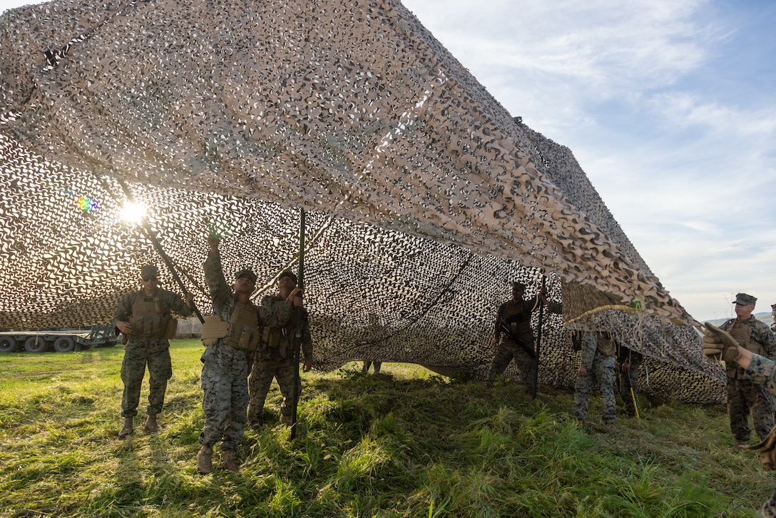 U.S. Marines with Marine Wing Support Squadron 371, Marine Air Control Group 38, 3rd Marine Aircraft Wing, set up a tactical motor pool during a company field exercise at Marine Corps Base Camp Pendleton, California, Feb. 24, 2026. The exercise demonstrated the unit’s ability to sustain ground transportation operations for 3rd MAW in support of the Marine Air Ground Task Force. (U.S. Marine Corps photo by Lance Cpl. Samantha Devine)