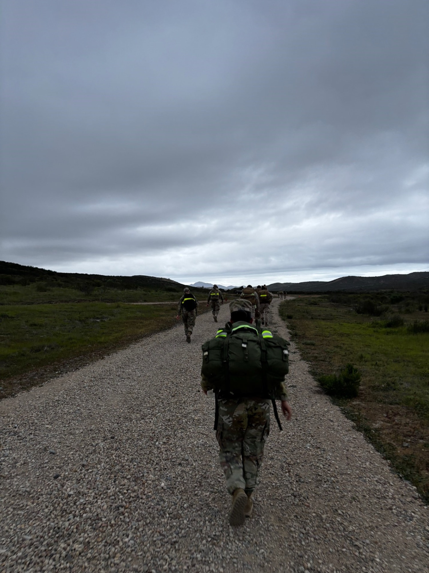 A group of SSC Guardians make their way along a loose gravel trail during the Blood Strike Ruck in Miramar, Calif., on Feb. 11, 2026. The Norwegian Foot March event was an 18.64-mile timed march that originated as a test of marching endurance for soldiers in the Norwegian military in 1915. This Blood Strike Ruck was conducted to assess Marines’ ability to move under load across an extended distance, build unit cohesion, and enhance combat readiness. (USSF Photo by Col. A.J. Ashby SYD 88 commander.)