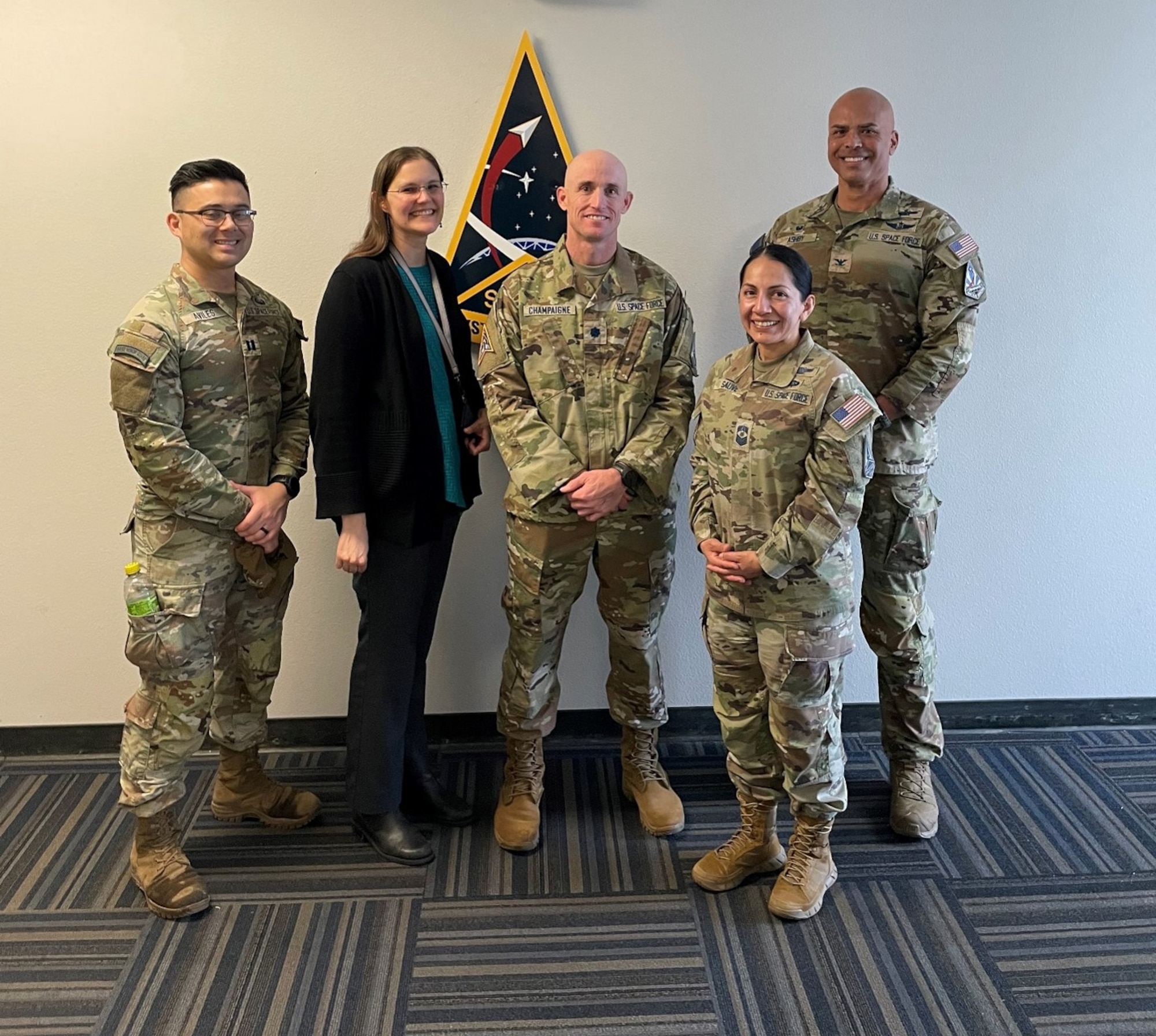 (Left to right) Capt. Jose Aviles Jr., SYD 84, Katherine Coens, with SSC’s MOUS program office, Lt. Col. Kevin Champaigne, SYD 88, CMSgt. Jacqueline Sauvé, SSC senior enlisted leader, Capt. Jose Aviles Jr., SYD 88, and Col. A.J. Ashby SYD 88 commander, meet at the SYD 88 Narrow Band Facility in San Diego. Sauvé toured the facility and met with team members following a 30-kilometer Norwegian Foot March with U.S. Marines at East Marine Corps Air Station Miramar, Calif., on Feb. 11, 2026. (USSF Photo by TSgt. Brian Anderson)