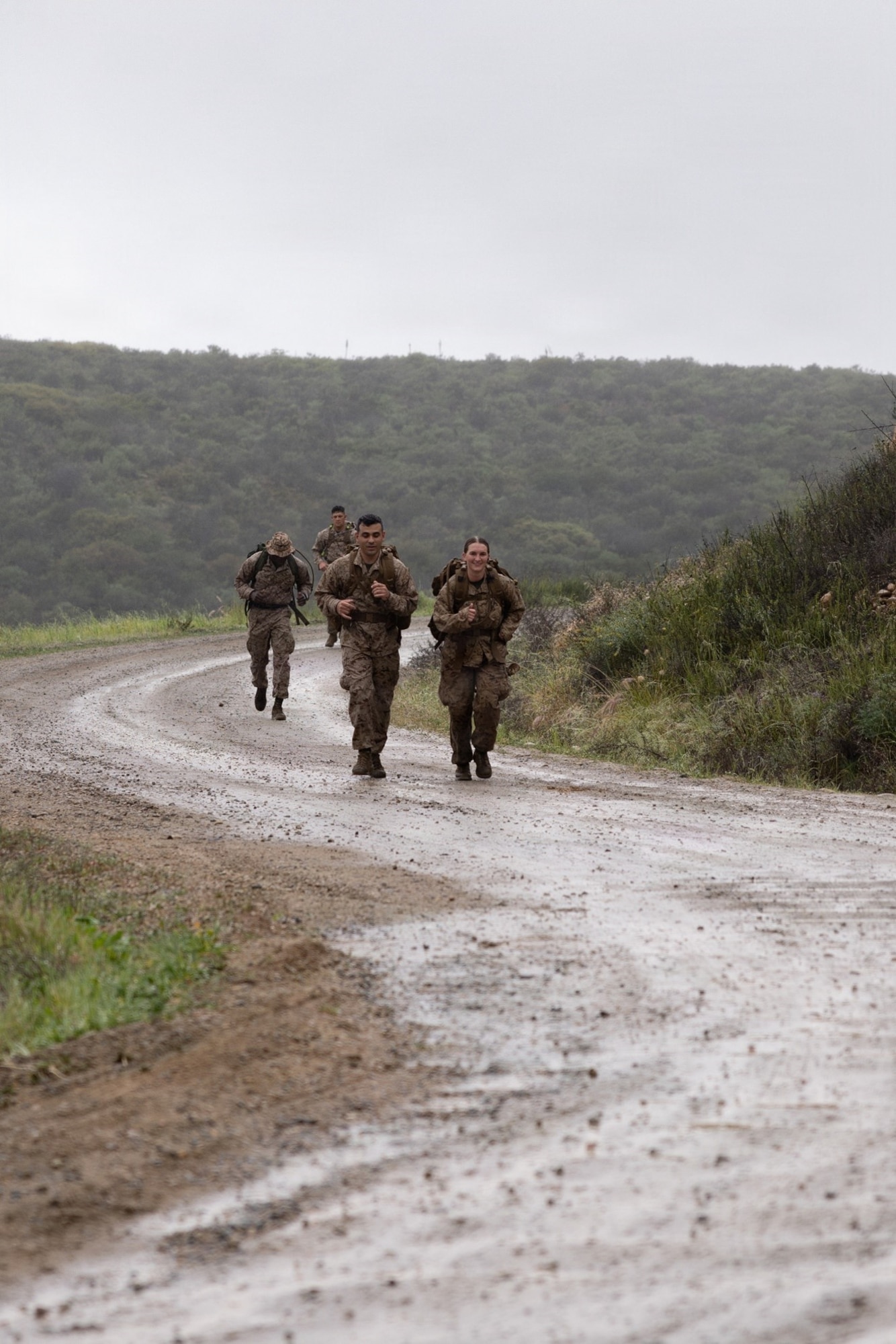 U.S. Marines with Marine Wing Communications Squadron 38, Marine Air Control Group 38, 3rd Marine Aircraft Wing, participate in a Norwegian Foot March at Marine Corps Air Station Miramar, California, Feb. 11, 2026. The event was an 18.64-mile timed event that originated as a test of marching endurance for soldiers in the Norwegian military in 1915, and was conducted to assess Marines’ ability to move under load across an extended distance, build unit cohesion, and enhance combat readiness. (U.S. Marine Corps photo by Lance Cpl. Samantha Devine)