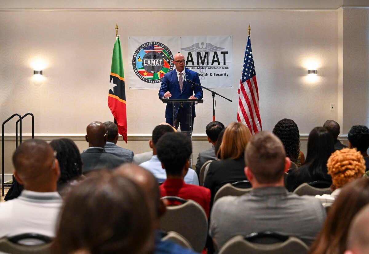 U.S. Air Force Lt. Col. Barry Davis, general surgeon and LAMAT 2026 mission commander, speaks during the Lesser Antilles Medical Assistance Team (LAMAT) 2026 opening ceremony, in Basseterre, Saint Kitts on Feb. 22, 2026. Davis previously participated in the Federation’s first LAMAT engagement in 2024 and now returns as the mission commander. (U.S. Air Force Photo by Staff Sgt. Dakota Carter)