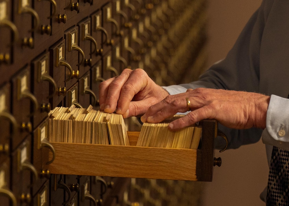Samuel Shearin, Air Force Historical Research Agency lineage, honors and heraldry division historian, searches through a card catalog at Maxwell Air Force Base, Alabama, Feb. 26, 2026.
