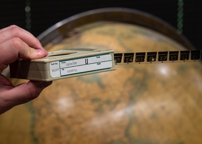 Nicholas Rich, Air Force Research Institute Agency archivist, displays a microfilm cassette at Maxwell Air Force Base, Alabama, Feb. 26, 2026.