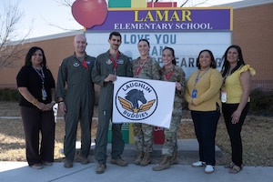 U.S. Air Force Airmen assigned to the 47th Flying Training Wing and faculty from Lamar Elementary School pose for a group photo at Del Rio, Texas, Feb. 19, 2026. The 47 FTW and Lamar Elementary created the Laughlin Buddies afterschool program to teach students about STEM careers inside the Air Force and beyond. (U.S. Air Force photo by Airman 1st Class Darryl Keith)