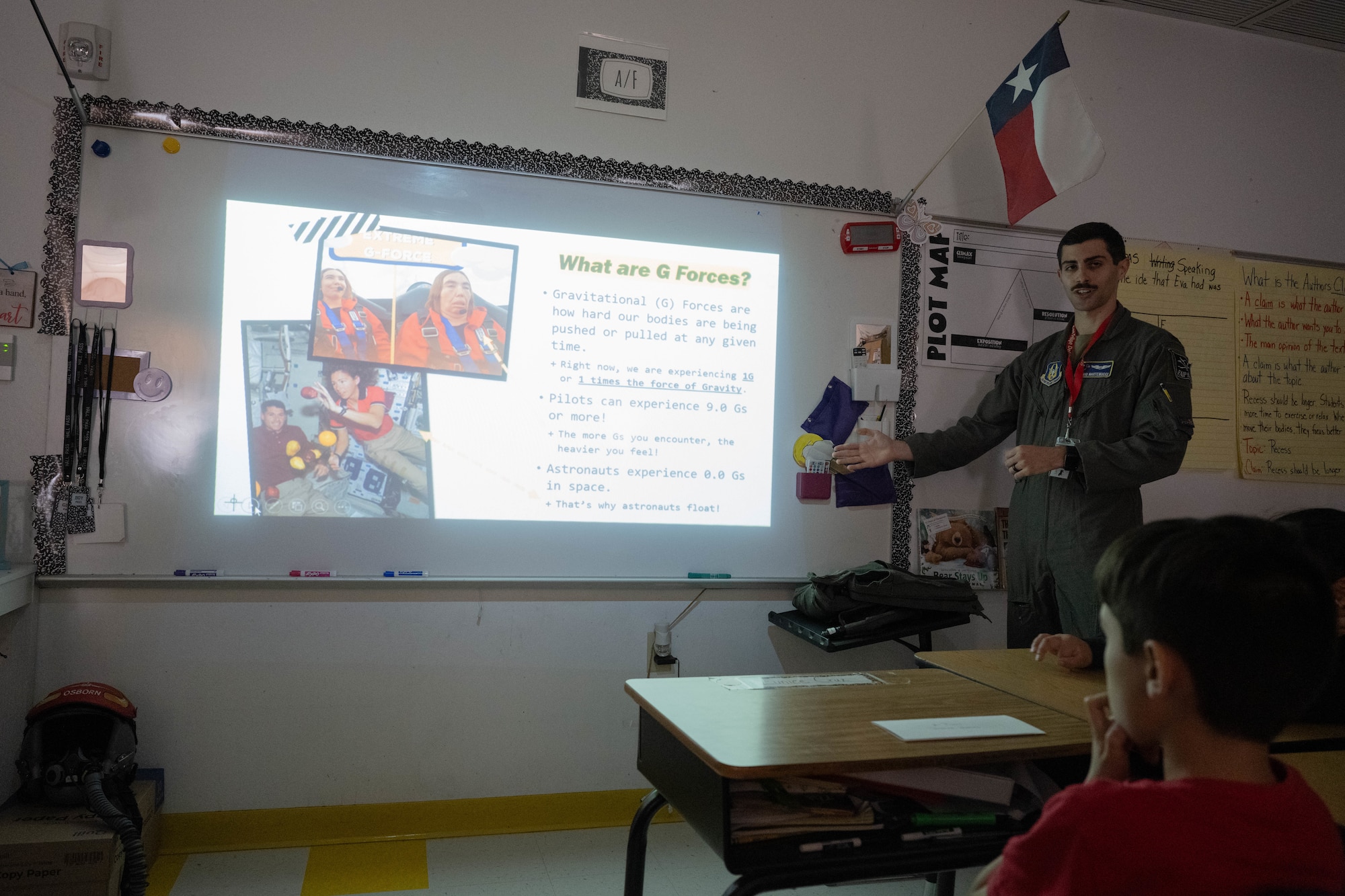 U.S. Air Force 1st Lt. Mario Martemucci, 96th Flying Training Squadron T-38 instructor pilot, showcases a presentation slide about G-forces at Lamar Elementary School in Del Rio, Texas, Feb. 19, 2026. Martemucci served as a guest instructor for the Laughlin Buddies afterschool program. (U.S. Air Force photo by Airman 1st Class Darryl Keith)