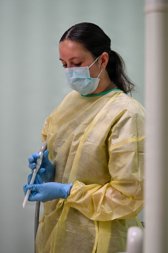 U.S. Air Force Reserve Tech. Sgt. Courtney Hubenthal, 419th Medical Squadron dental technician, assists in the repair of a dental filling on a Nevisian patient at Charlestown Dental Clinic in Charlestown, Nevis, Feb. 24, 2026. This procedure was part of the Lesser Antilles Medical Assistance Team 2026 mission, a mutually beneficial engagement that combines humanitarian assistance with real-world collaboration in a joint-clinical setting. (U.S. Air Force Photo by Staff Sgt. Dakota Carter)