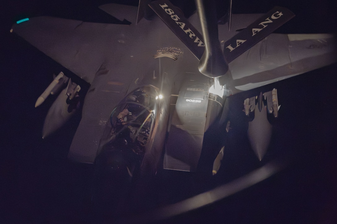 U.S. CENTRAL COMMAND AREA OF RESPONSIBILITY (Dec. 19, 2025) A U.S. Air Force F-15E Strike Eagle aircraft receives fuel from a KC-135 Stratotanker aircraft during Operation HAWKEYE STRIKE over the U.S. Central Command area of responsibility, Dec. 19, 2025. (U.S. Air Force Photo)