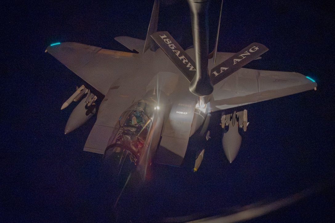 U.S. CENTRAL COMMAND AREA OF RESPONSIBILITY (Dec. 19, 2025) A U.S. Air Force F-15E Strike Eagle aircraft receives fuel from a KC-135 Stratotanker aircraft during Operation HAWKEYE STRIKE over the U.S. Central Command area of responsibility, Dec. 19, 2025. (U.S. Air Force Photo)