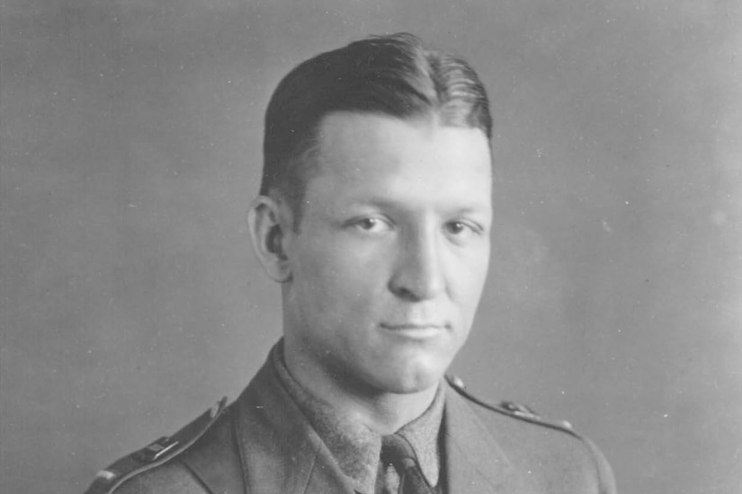 A man in uniform poses for a photo.