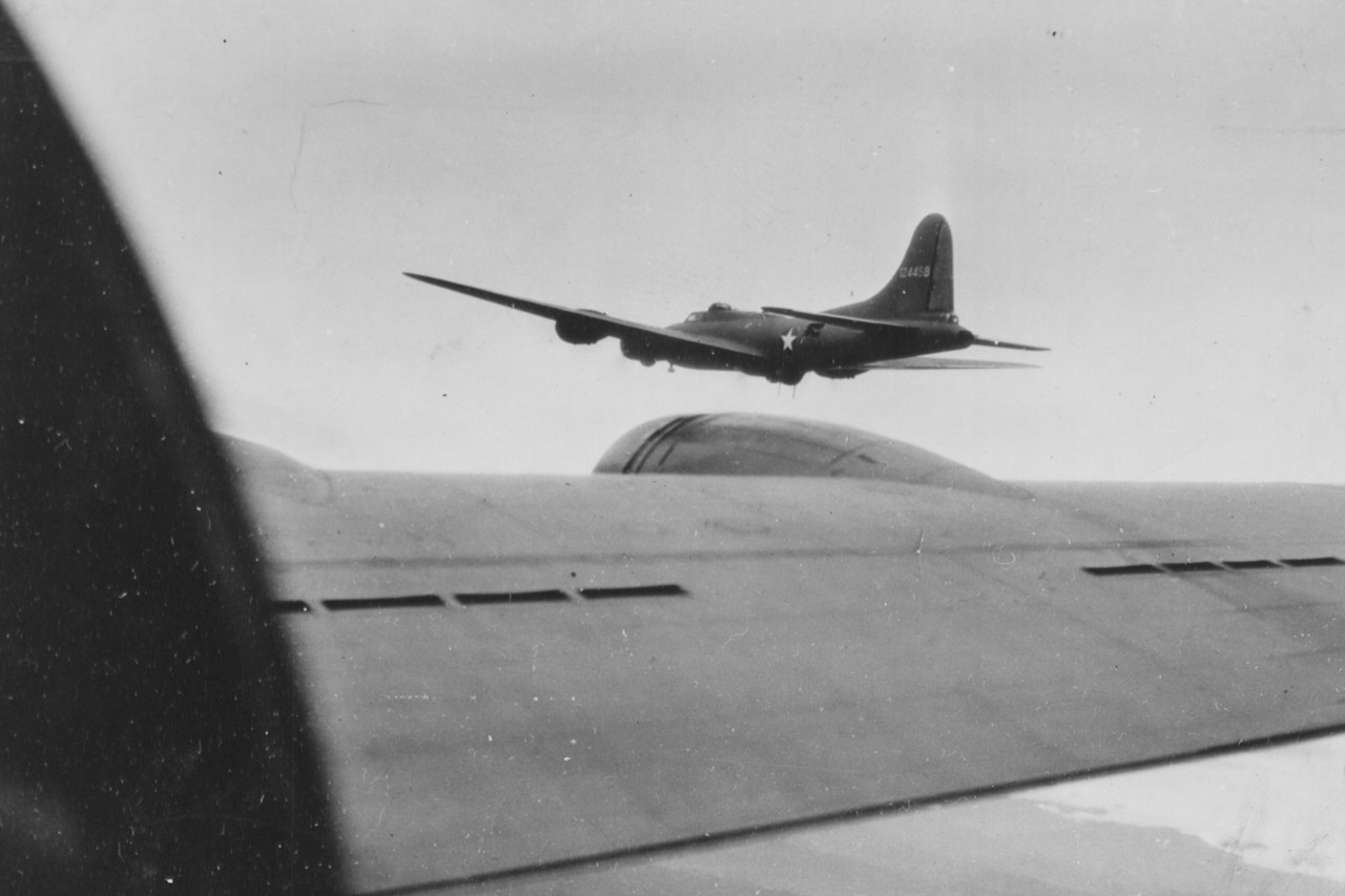 An aircraft is seen from the wing of another aircraft.