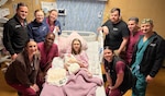 Staff of Walter Reed’s Mother Infant Care Center celebrates the birth of the first baby of 2026 born at Walter Reed, Brook Crone, with her proud parents retired U.S. Marines Andrea and Caleb Crone on New Year’s Day.