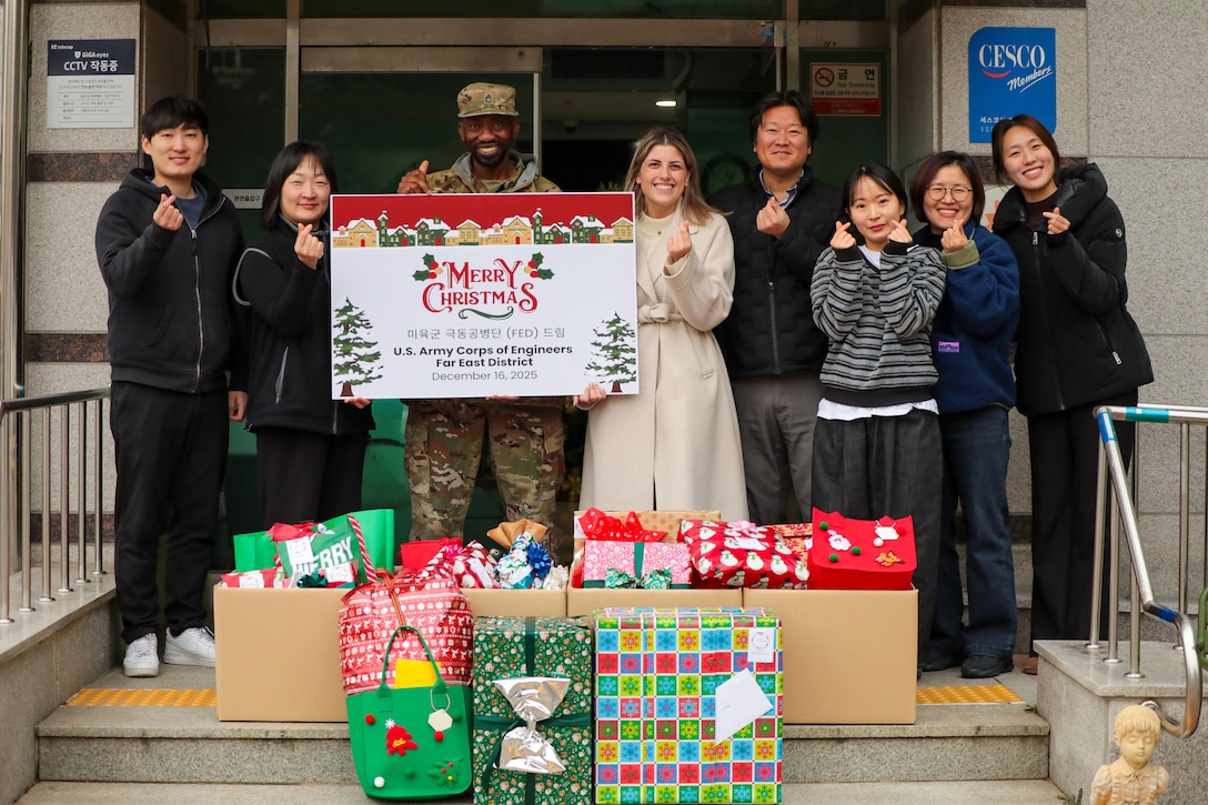 U.S. Army Corps of Engineers – Far East District (FED) employees visit Sungyook Children’s Home, located in Pyeongtaek, South Korea, to deliver holiday gifts donated by FED employees, Dec. 16, 2025. The employees pose with the home’s managers in front of the building for the fifth consecutive year of FED's community outreach efforts for the facility.  (U.S. Army photo by Monique Freemon)