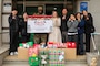U.S. Army Corps of Engineers – Far East District (FED) employees visit Sungyook Children’s Home, located in Pyeongtaek, South Korea, to deliver holiday gifts donated by FED employees, Dec. 16, 2025. The employees pose with the home’s managers in front of the building for the fifth consecutive year of FED's community outreach efforts for the facility.  (U.S. Army photo by Monique Freemon)