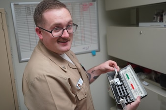 260104-N-FT324-8160. ROTA, Spain (January 4, 20226) — Hospital Corpsman 2nd Class Logan T. Pentz, a Preventive Medicine Technician assigned to Naval Medical Readiness and Training Command Rota, prepares sampling equipment while conducting routine public health monitoring. Pentz supports Navy Medicine’s mission by identifying potential health risks, ensuring environmental safety, and protecting the health and readiness of Sailors and operational forces. (U.S. Navy Released By Lt. Cmdr. Alicia Sacks)