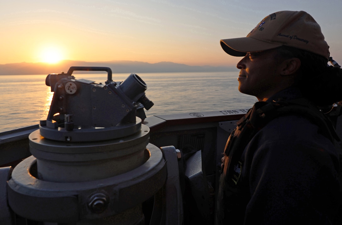 ARABIAN GULF (Dec. 15, 2025) U.S. Navy Chief Gunner's Mate Shontae Robinson, assigned to the Arleigh Burke-class guided-missile destroyer USS Roosevelt (DDG 80), stands small craft action team watch in the Arabian Gulf. Roosevelt is deployed to the U.S. 5th Fleet area of operations to support maritime security and stability in the U.S. Central Command area of responsibility. (U.S. Navy photo by Mass Communication Specialist 1st Class Indra Beaufort)