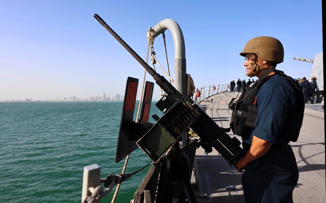 ARABIAN SEA (Dec. 30, 2025) U.S. Navy Fire Controlman (Aegis) 3rd Class Bryan Ramirez, assigned to the Arleigh Burke-class guided-missile destroyer USS Roosevelt (DDG 80), stands small craft action team lookout watch during a sea-and-anchor evolution in the Arabian Sea. Roosevelt is deployed to the U.S. 5th Fleet area of operations to support maritime security and stability in the U.S. Central Command area of responsibility. (U.S. Navy photo by Mass Communication Specialist 1st Class Indra Beaufort)