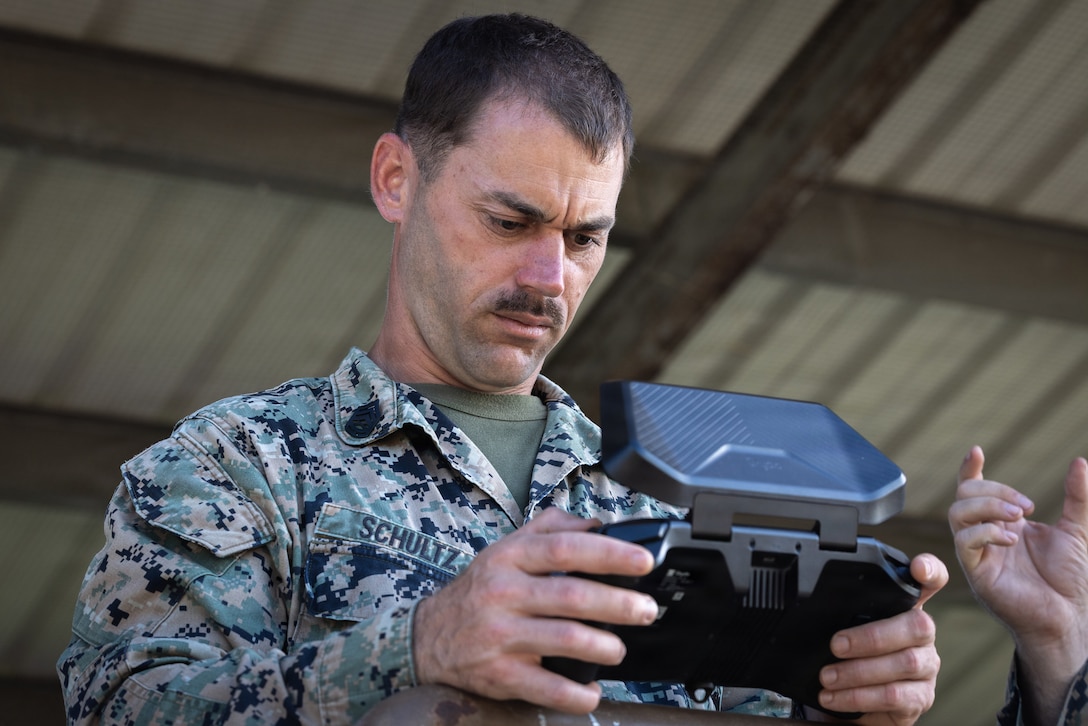 A U.S. Marine with Combat Logistics Battalion 26, 22nd Marine Expeditionary Unit (Special Operations Capable) operates a Skydio X2D small unmanned aircraft system during a seeking exercise at Camp Santiago, Puerto Rico, Dec. 19, 2025. U.S. military forces are deployed to the Caribbean in support of the U.S. Southern Command mission, Department of War-directed operations, and the president's priorities to disrupt illicit drug trafficking and protect the homeland. (U.S. Marine Corps photo)