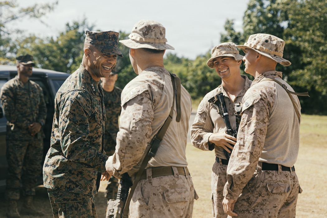 U.S. Marine Corps Lt. Gen. Calvert Worth, left, commanding general, II Marine Expeditionary Force, is greeted by leaders with Lima Company, Battalion Landing Team 3/6, 22nd Marine Expeditionary Unit (Special Operations Capable), on Camp Santiago, Puerto Rico, Dec. 12, 2025. U.S. military forces are deployed to the Caribbean in support of the U.S. Southern Command mission, Department of War-directed operations, and the president's priorities to disrupt illicit drug trafficking and protect the homeland. (U.S. Marine Corps photo)