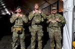 From left, U.S. Air Force Senior Airman Brett Fries, U.S. Army Pfc. Tyler E. Farley and Sgt. Devin Cantwell, members of the West Virginia National Guard, pose for a photo before their patrols in Washington, D.C., Dec. 31, 2025. On Dec. 15, 2025, they helped extinguish a dryer fire in an apartment building on Massachusetts Avenue Northwest. About 2,500 National Guard members are supporting the D.C. Safe and Beautiful mission, providing critical support to the Metropolitan Police Department to help ensure the safety of those who live, work in and visit the District. Photo by Tech. Sgt. Renee Crugnale.