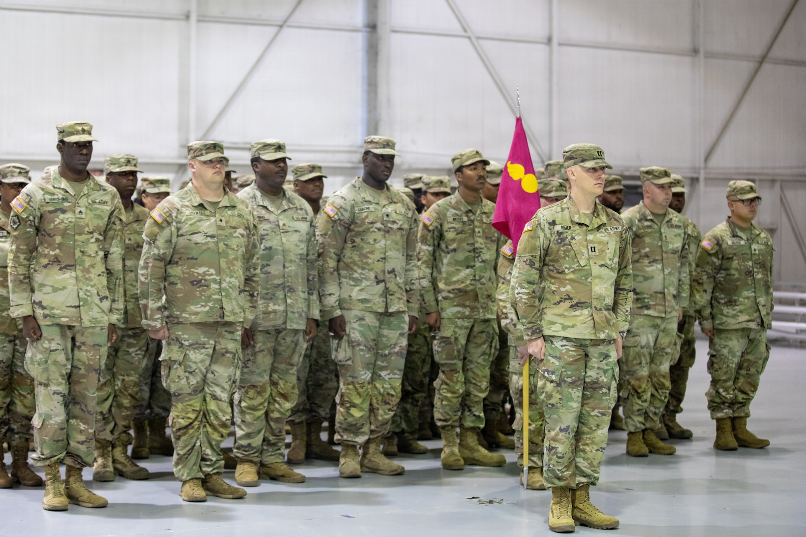 Soldiers with the Kennesaw-based 277th Maintenance Company, 110th Combat Sustainment Support Battalion, 78th Troop Command, Georgia Army National Guard, stand at attention with the uncased guidon during their Welcome Home Ceremony at Hangar Five, Clay National Guard Center, Marietta, Georgia, Dec. 12, 2025. The 277th Maintenance Company has supported numerous emergency response operations and has most recently provided personnel and expertise in support of Joint Task Force-Southern Border (JTF-SB). (U.S. Army National Guard photo by Sgt Alex Lopez)