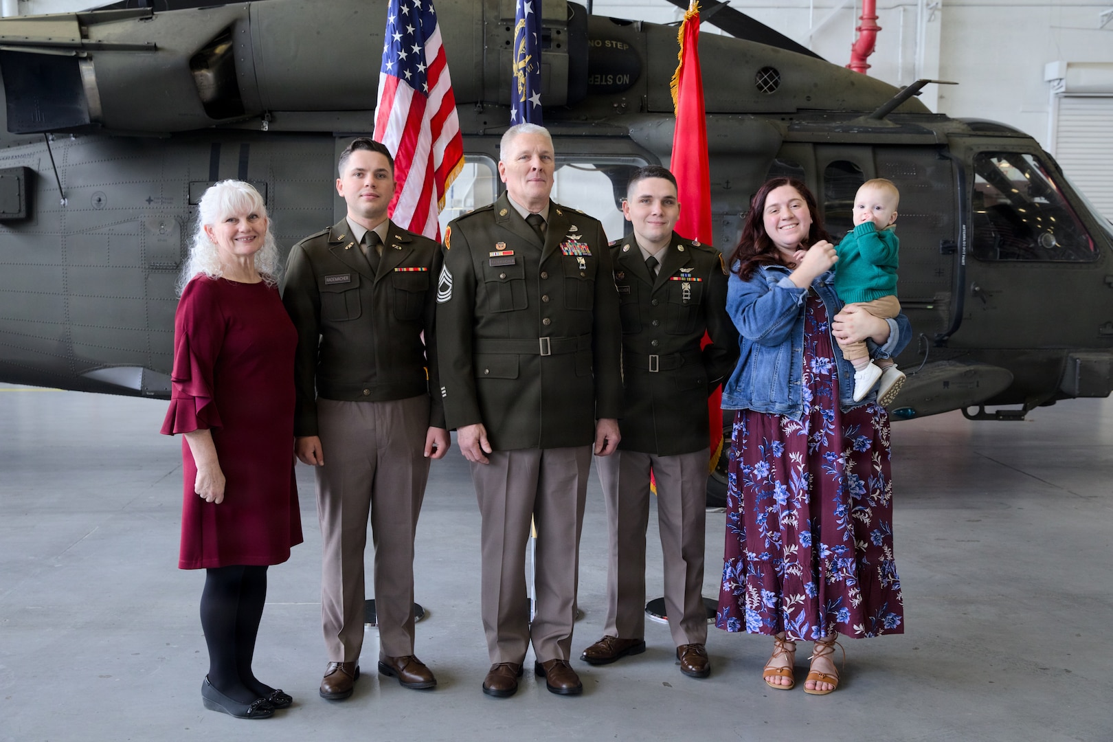 Master Sergeant Jerome "Jay" Rademacher stands with his family for a photo during his retirement ceremony Dec. 7, 2025 at the Clay National Guard Center in Marietta, Ga.