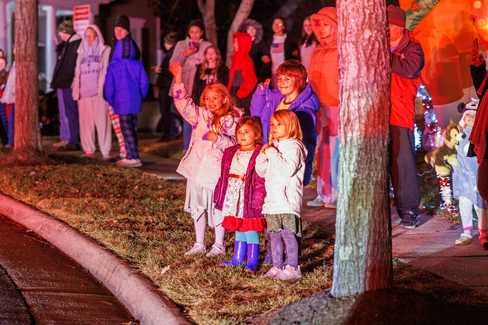 Families wait for Santas arrival during the 5th Annual Santa Run on Marine Corps Base Quantico, Virginia, Dec. 20, 2025. The Santa run is an event organized by Station 31 Firefighters to bring holiday cheer to residents aboard MCB Quantico. (U.S. Marine Corps photo by Lance Cpl. Donovan E. Melendez)