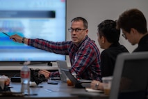 people sit at a conference table