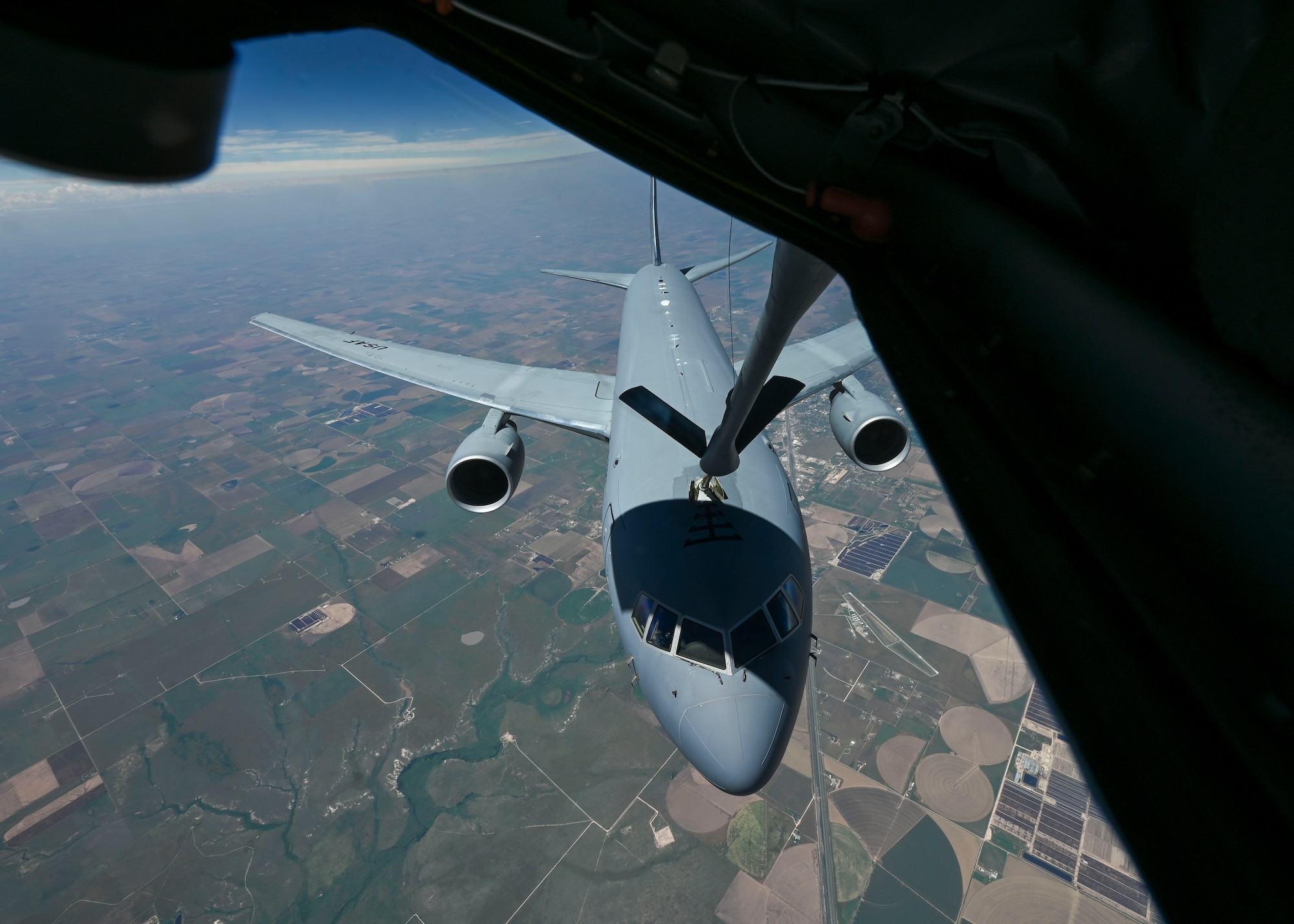 A KC-46A Pegasus from the 931st Air Refueling Wing at McConnell Air Force Base, Kansas, receives fuel from a KC-135 Stratotanker from the 350th Air Refueling Squadron at McConnell, over Kansas, June 4, 2025. The KC-46 is the Air Force’s newest tanker and poses greater refueling, cargo and aeromedical evacuation capabilities compared to the KC-135. (U.S. Air Force photo by Senior Airman Paige Weldon)