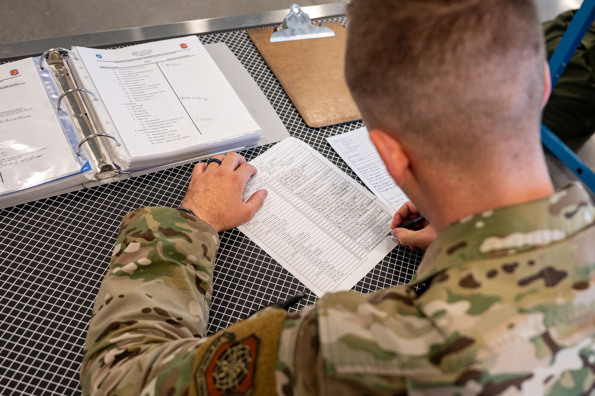 Airman writes on a paper