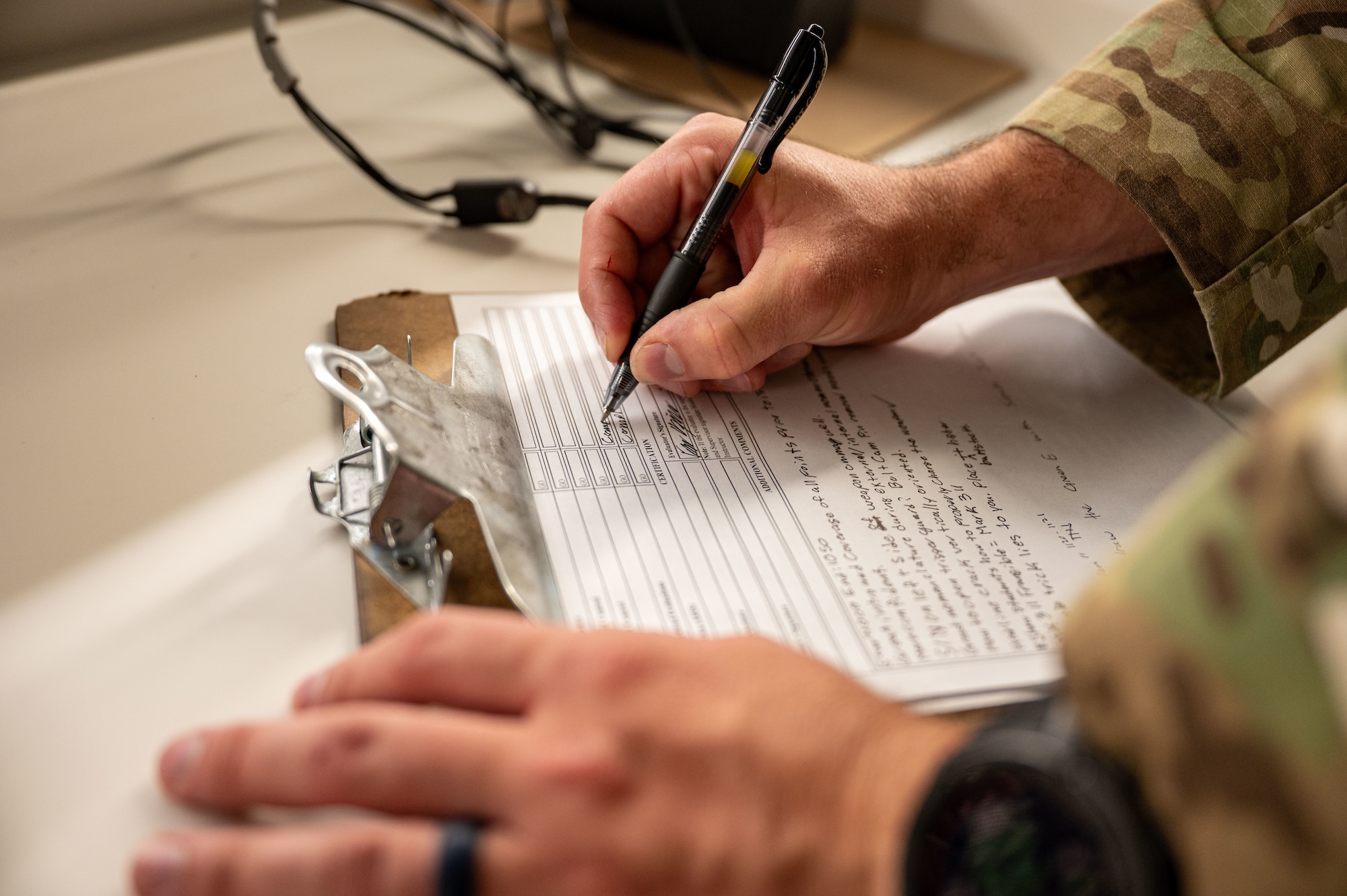 Airman writes on paper