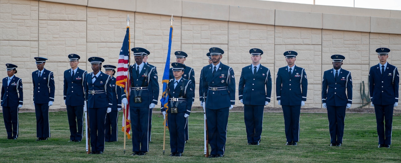 Luke Air Force Base Honor Guard members stand in formation as they prepare for a recognition ceremony honoring Airmen who received challenge coins from the Vice Chief of Staff of the Air Force, Dec. 2, 2025, at Luke Air Force Base, Arizona.