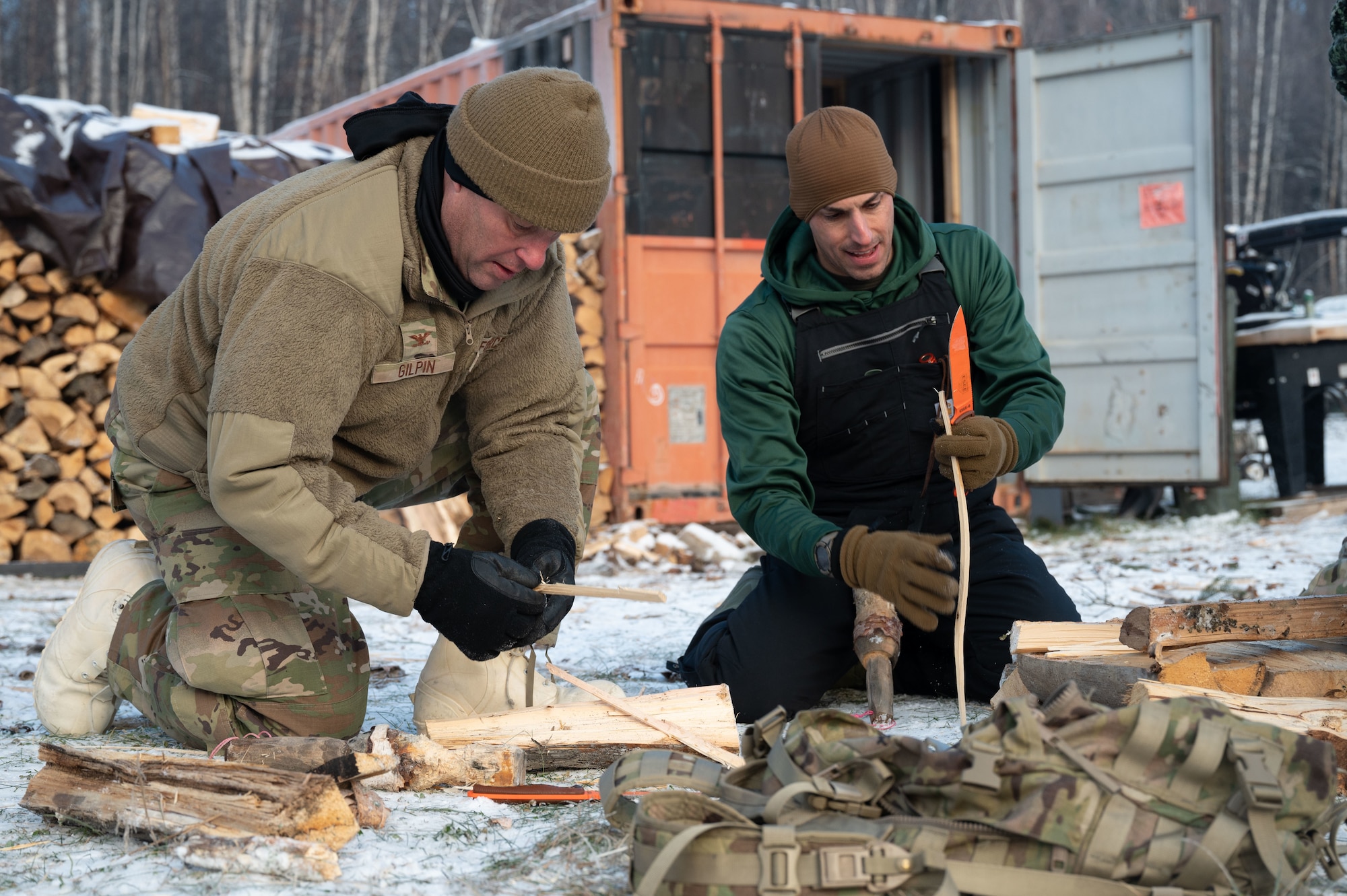 U.S. Air Force Col. Joseph Gilpin, 354th Maintenance Group commander, left and Chief Master Sgt. Matthew Perry, 354th MXG senior enlisted leader, prepares wood during Arctic Resiliency Training at Eielson Air Force Base, Alaska, October 29, 2025.
