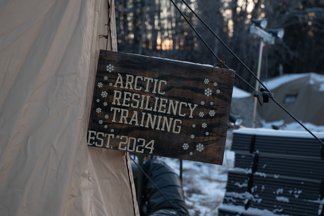 The Arctic Resiliency Training sign hangs outside the course's main tent at Eielson Air Force Base, Alaska, Oct. 29, 2025.