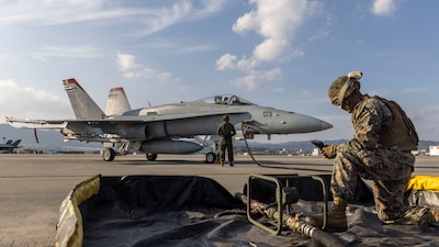 MARINE CORPS AIR STATION, Japan (Dec. 30, 2025) — U.S. Marines with Marine Aircraft Group 12, 1st Marine Aircraft Wing, refuel an F/A-18C Hornet aircraft with Marine Fighter Attack Squadron (VMFA) 232, MAG-12, 1st MAW, at Marine Corps Air Station...