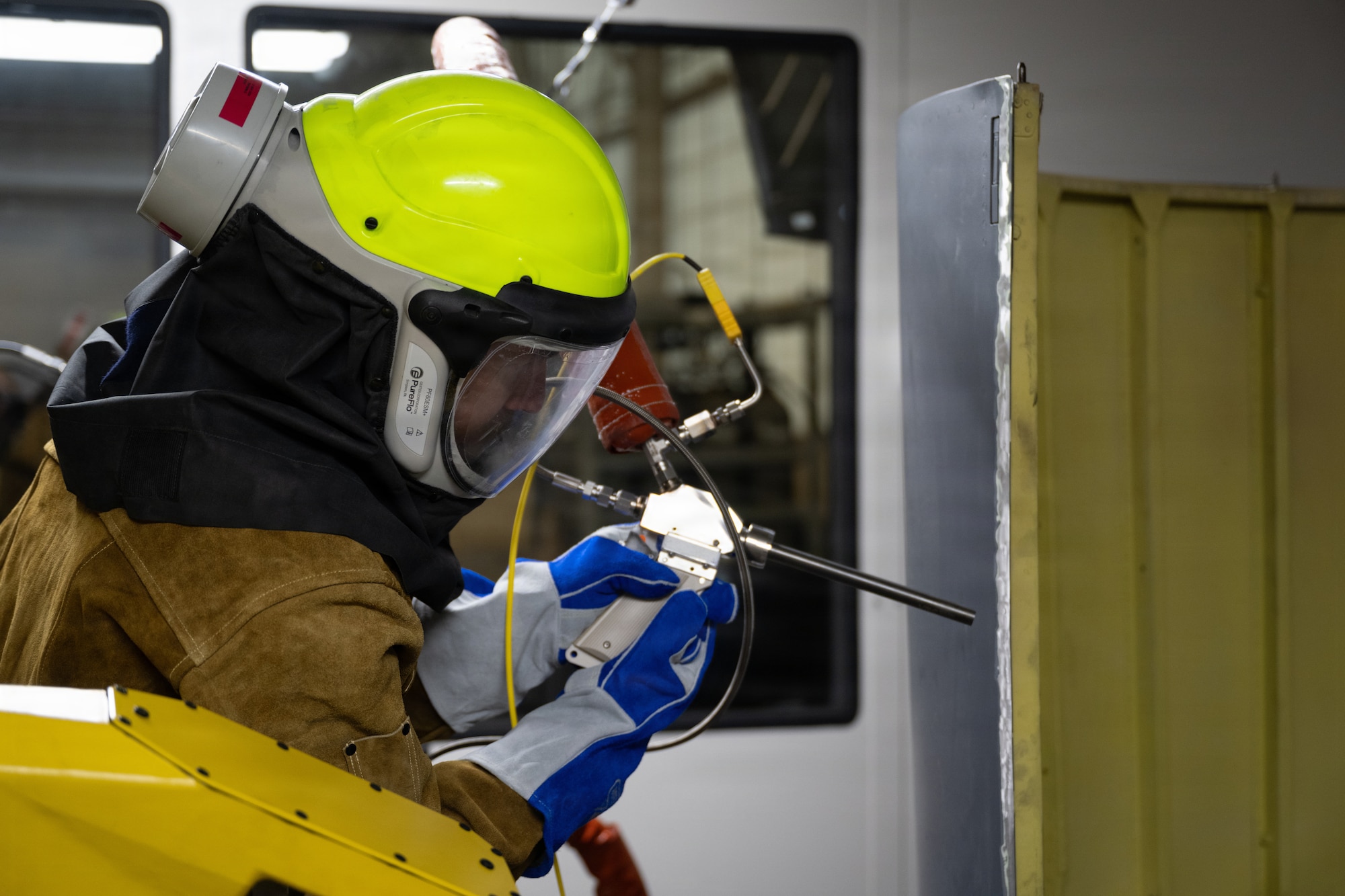 Retired Master Sgt. Applies cold spray metal