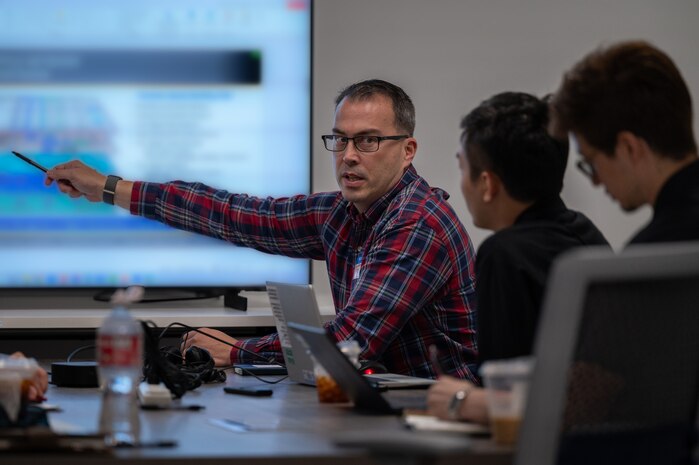 people sit at a conference table