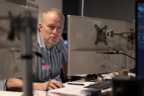 person works at computer