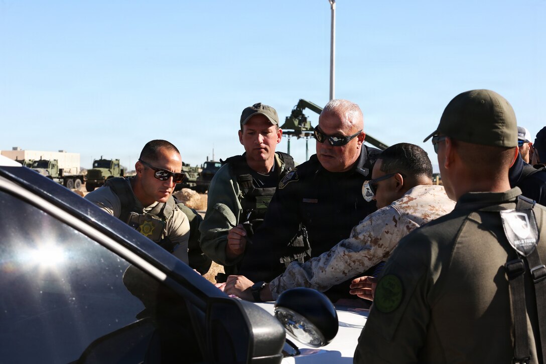 Marines and interagency partners engaged in an Interagency Active Shooter and Mass Casualty Exercise on the Yermo Annex aboard Marine Corps Logistics Base Barstow, 10 December 2025.
“This full-scale regional command training and interoperability exercise is designed to enhance emergency preparedness and rapid response capabilities to violent incidents,” said Maj Grant Burnett, director of Operations. “The exercise involved coordination with key interagency partners, including local law enforcement, local fire and emergency services, as well as federal law agencies.”
Personnel and other resources from the San Bernardino County Sheriffs Office, Naval Criminal Investigation Services, Barstow Fire, California Highway Patrol, Federal Bureau of Investigation, and Mercy Air worked closely with the Provost Marshal’s law enforcement officers, Fire and Emergency Services’ firefighters and paramedics, Dispatch teams, and Base Operations to conduct simulations in-order-to test installation’s emergency response protocols for active shooters and mass casualty incidents.
This complex and multi-faceted training brings together our local agencies and improves communications, working relations, and team building.
Photo by Leo Ritualo.