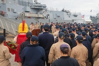 Cmdr. Joseph Phillips, commanding officer of the Arleigh Burke-class guided-missile destroyer USS Paul Ignatius (DDG 117), delivers remarks during a change of command ceremony onboard Naval Station Rota, Spain, on January 1, 2026.