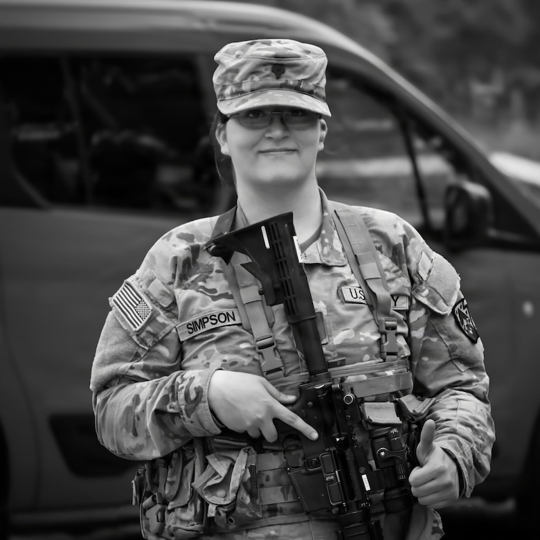 U.S. Army Spc. Skylin Simpson, a public affairs specialist with the 109th Mobile Public Affairs Detachment, 213th Regional Support Group, Pennsylvania National Guard, poses for a photo at a firing range during an exercise at Fort Indiantown Gap, Pennsylvania, July 13, 2025. (U.S. Army National Guard photo by Maj. Travis Mueller)