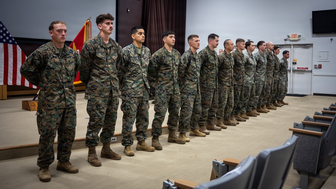 U.S. Marines and Sailors from 2nd Marine Division stand at parade rest during the 2nd Marine Division quarterly awards ceremony on Marine Corps Base Camp Lejeune, North Carolina, Dec. 19, 2025. During the ceremony, Maj. Gen. Farrell J. Sullivan, the commanding general of 2nd Marine Division presented awards for Marine of the Quarter, Non-Commissioned Officer of the Quarter, and Sailor of the Quarter. (U.S. Marine Corps photo by Lance Cpl. Brian Bolin Jr.)